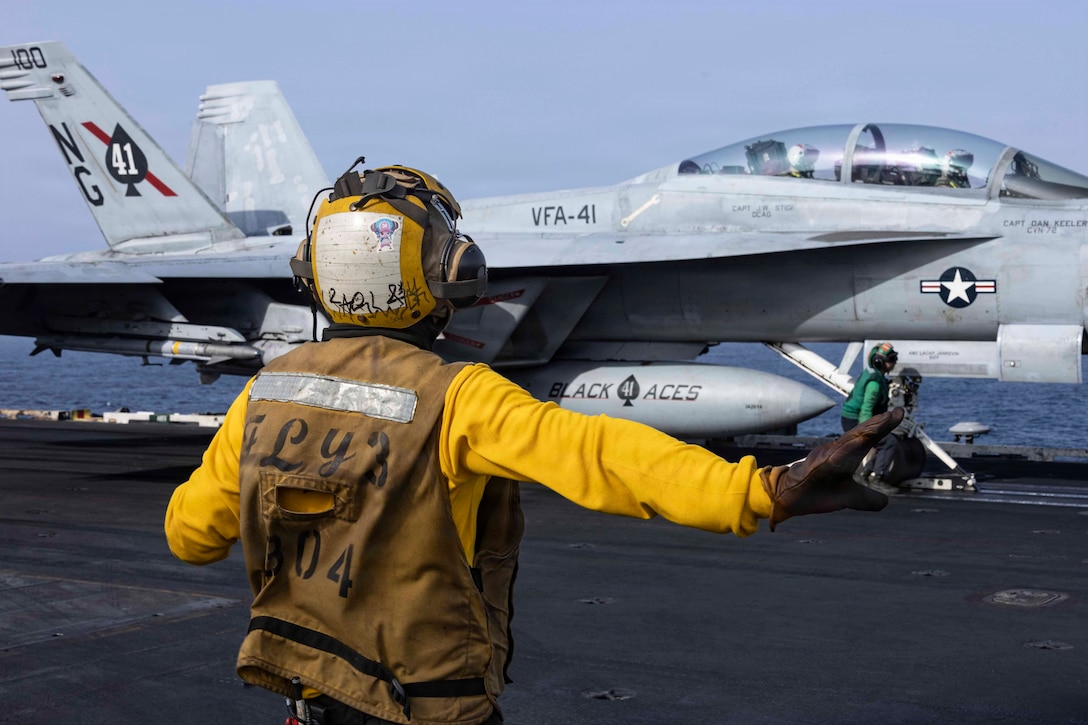 An F/A-18F Super Hornet, attached to Strike Fighter Squadron (VFA) 41, prepares to launch from the flight deck of Nimitz-class aircraft carrier USS Abraham Lincoln (CVN 72), June 25, 2026. Abraham Lincoln is deployed to the U.S. 5th Fleet area of operations to support maritime security and stability in the Middle East. (U.S. Navy photo)
