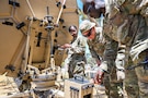 U.S. Airmen wire and test a satellite communications dish at a base in the U.S. Central Command area of responsibility June 12, 2026. (U.S. Air Force photo by Staff Sgt. Justin W. Moore)
