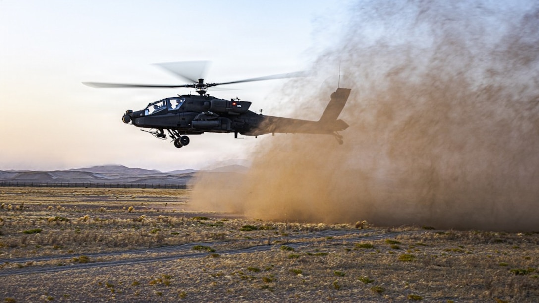 A U.S. Army AH-64 Apache attack helicopter takes off in the Middle East during routine flight operations. The Apache is equipped with sensors, avionics, and weapons systems designed to support reconnaissance and aerial security missions. (U.S. Army photo)