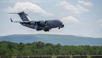 A C-17 Globemaster III lowers its landing gear as it prepares to land at Stewart Air National Guard Base, New York, May 20, 2026.