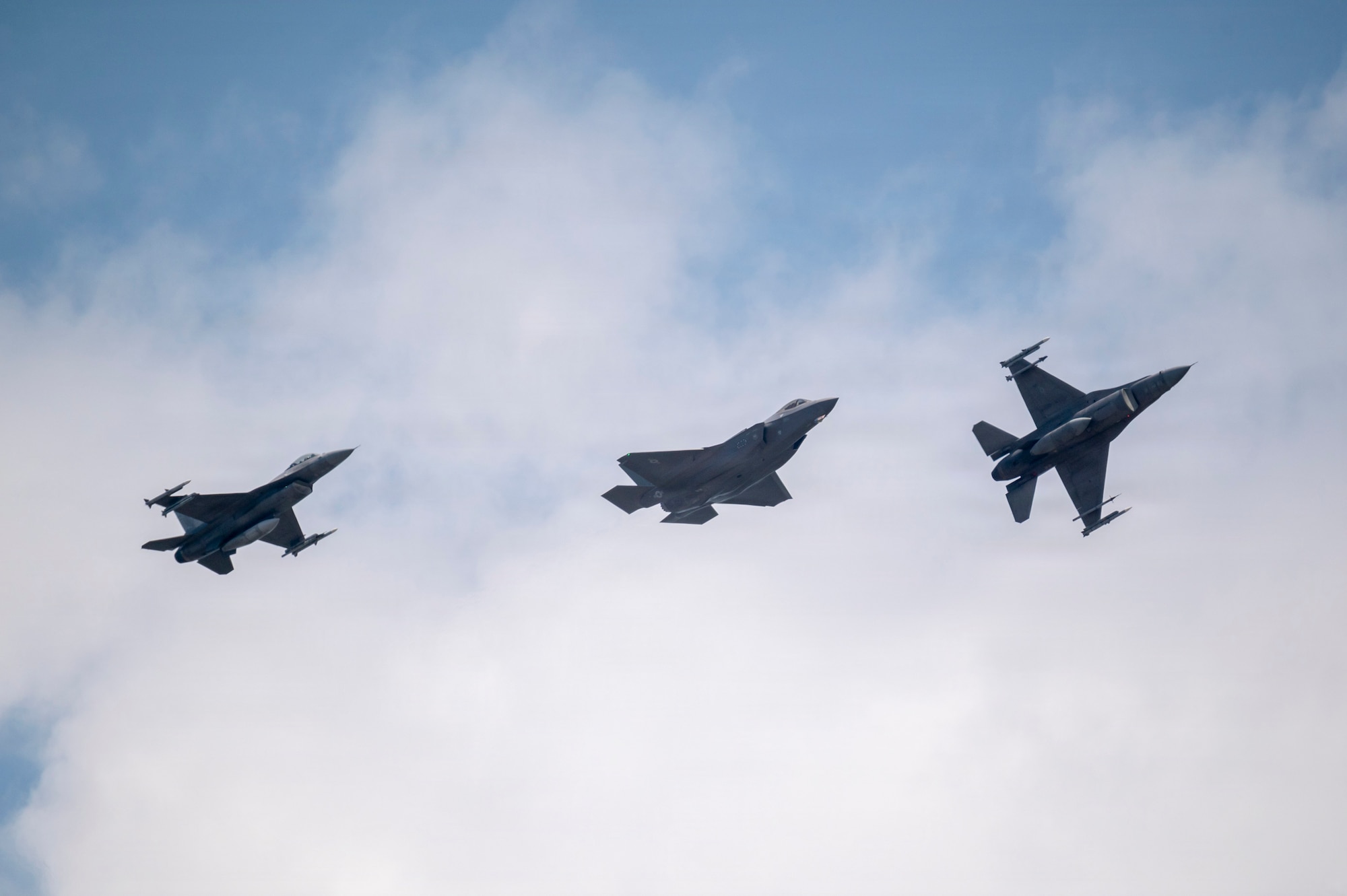 fighter jets fly in the sky