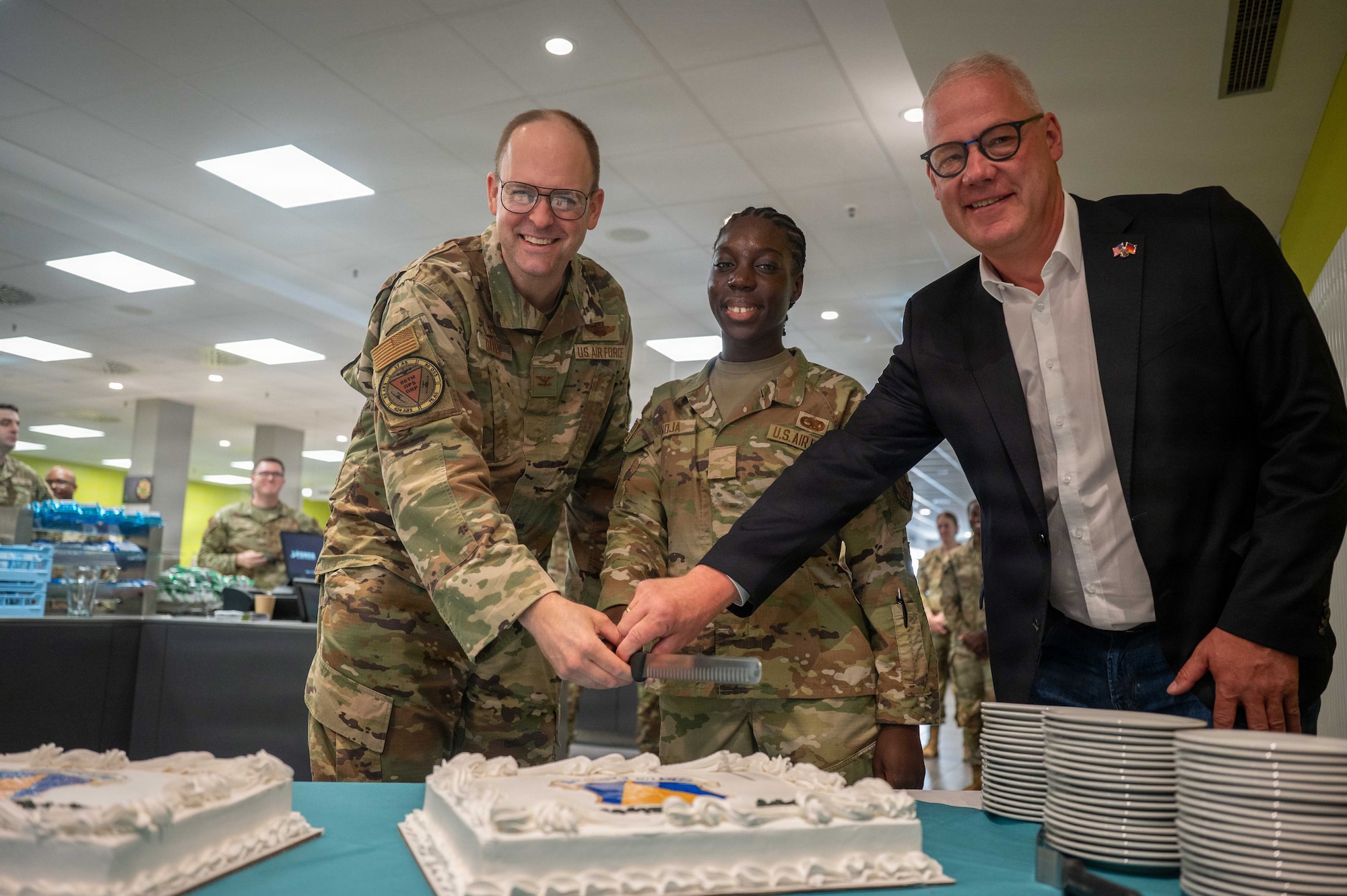 A photo of Airmen cutting a cake