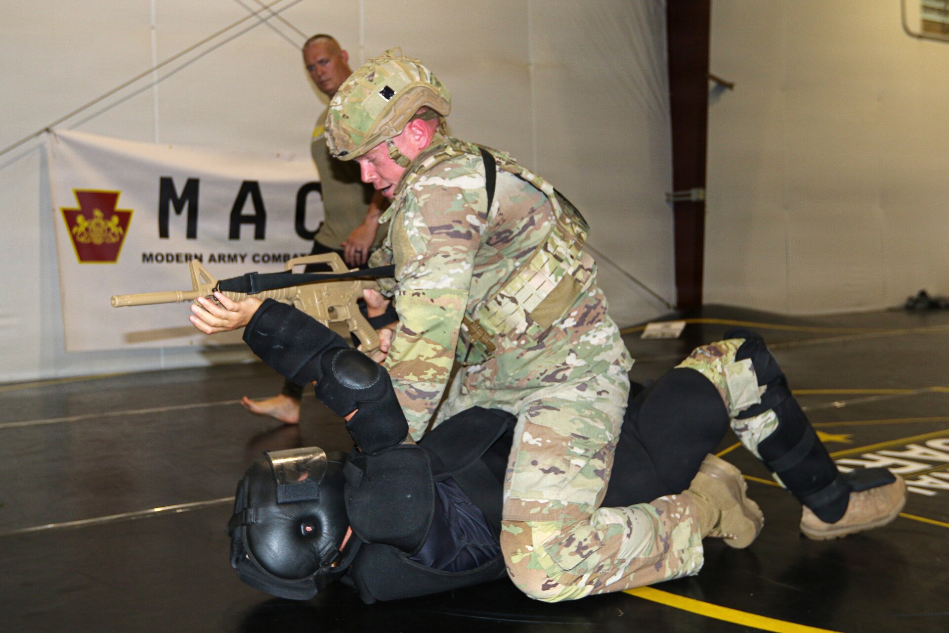 U.S. Army Soldiers participating in the Pennsylvania National Guard State Combatives Program's Basic Combatives Course demonstrate close-quarters combat techniques during the course's culminating training event at Fort Indiantown Gap, Pennsylvania, June 26, 2026. Throughout the 40-hour course, Soldiers developed foundational hand-to-hand combat skills through realistic, hands-on training. (U.S. Army National Guard photo by Sgt. 1st Class Shane Smith)