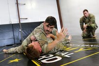 U.S. Army Soldiers participating in the Pennsylvania National Guard State Combatives Program's Basic Combatives Course demonstrate close-quarters combat techniques during the course's culminating training event at Fort Indiantown Gap, Pennsylvania, June 26, 2026. Throughout the 40-hour course, Soldiers developed foundational hand-to-hand combat skills through realistic, hands-on training. (U.S. Army National Guard photo by Sgt. 1st Class Shane Smith)