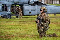 U.S. Army Sgt. 1st Class Alan San Nicolas of the Guam National Guard, assigned to Task Force Talon, 38th Air Defense Artillery Brigade, pulls security for a U.S. Navy SH-60 Seahawk during a joint medical evacuation and Air Assault tactical training event on Guam, May 26, 2026.