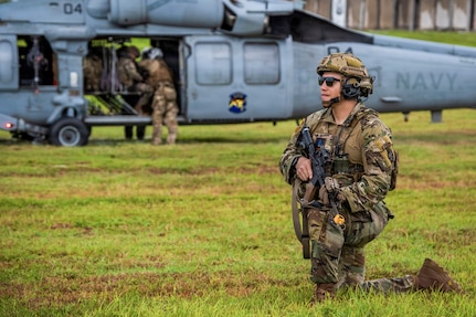 U.S. Army Sgt. 1st Class Alan San Nicolas of the Guam National Guard, assigned to Task Force Talon, 38th Air Defense Artillery Brigade, pulls security for a U.S. Navy SH-60 Seahawk during a joint medical evacuation and Air Assault tactical training event on Guam, May 26, 2026.