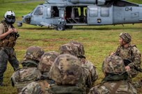 U.S. Army 1st Lt. Joseph Aquino of the Guam National Guard, assigned to Task Force Talon, 38th Air Defense Artillery Brigade, right, prepares his Soldiers to load a U.S. Navy SH-60 Seahawk during a joint medical evacuation and Air Assault tactical training event on Guam, May 26, 2026.