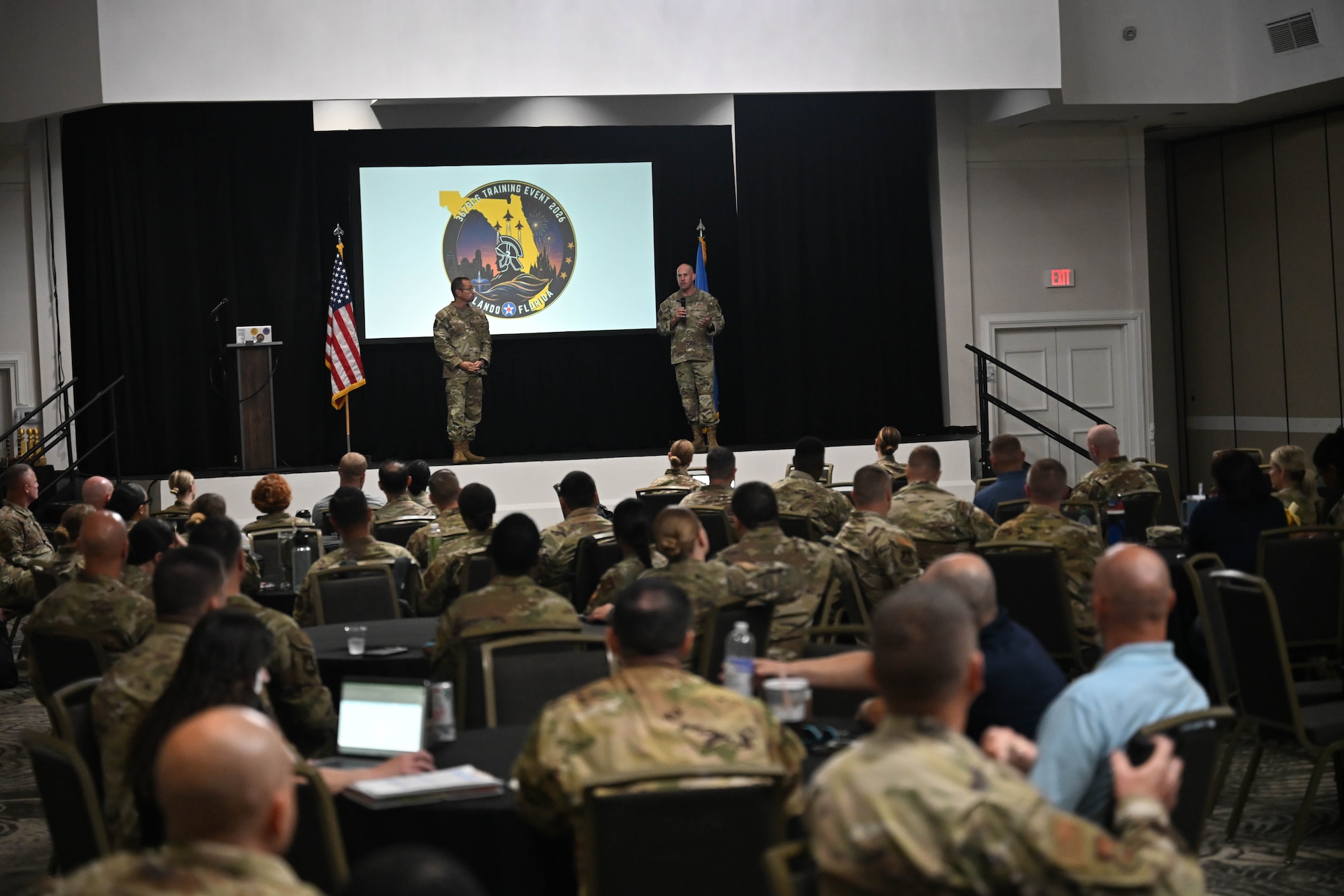 367th Recruiting Group leadership, Col. Sean "Metro" Fellows, 367 RCG commander, and Chief Master Sgt. Derek Hudson, 367 RCG senior enlisted leader, Robins Air Force Base, Georgia, discuss recruiting training on officer accessions, health professions, and 367 RCG group staff at the Group Training Event held June 8-11, 2026, in Orlando, Florida. (U.S. Air Force photo by Master Sgt. Della Creech)