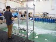 U.S. Naval Research Laboratory (NRL)-National Research Council (NRC) Postdoctoral Fellow with NRL’s Chemistry Division, Center for Corrosion Science and Engineering, Alex Johnson, studies the impact of corrosion from saltwater aerosols at the NRL Laboratory for Autonomous Systems Research (LASR) Littoral Bay Wave Pool, in Washington, D.C., Sept. 24, 2024. RELEASED