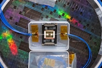 An active photonic integrated circuit (PIC) is displayed on a semiconductor wafer in Washington, D.C. May 17, 2024. The active PIC is designed by the U.S. Naval Research Laboratory and offers a simpler approach to signal processing by using optical fibers to process microwave signals. (U.S. Navy photo by Sarah Peterson) RELEASED