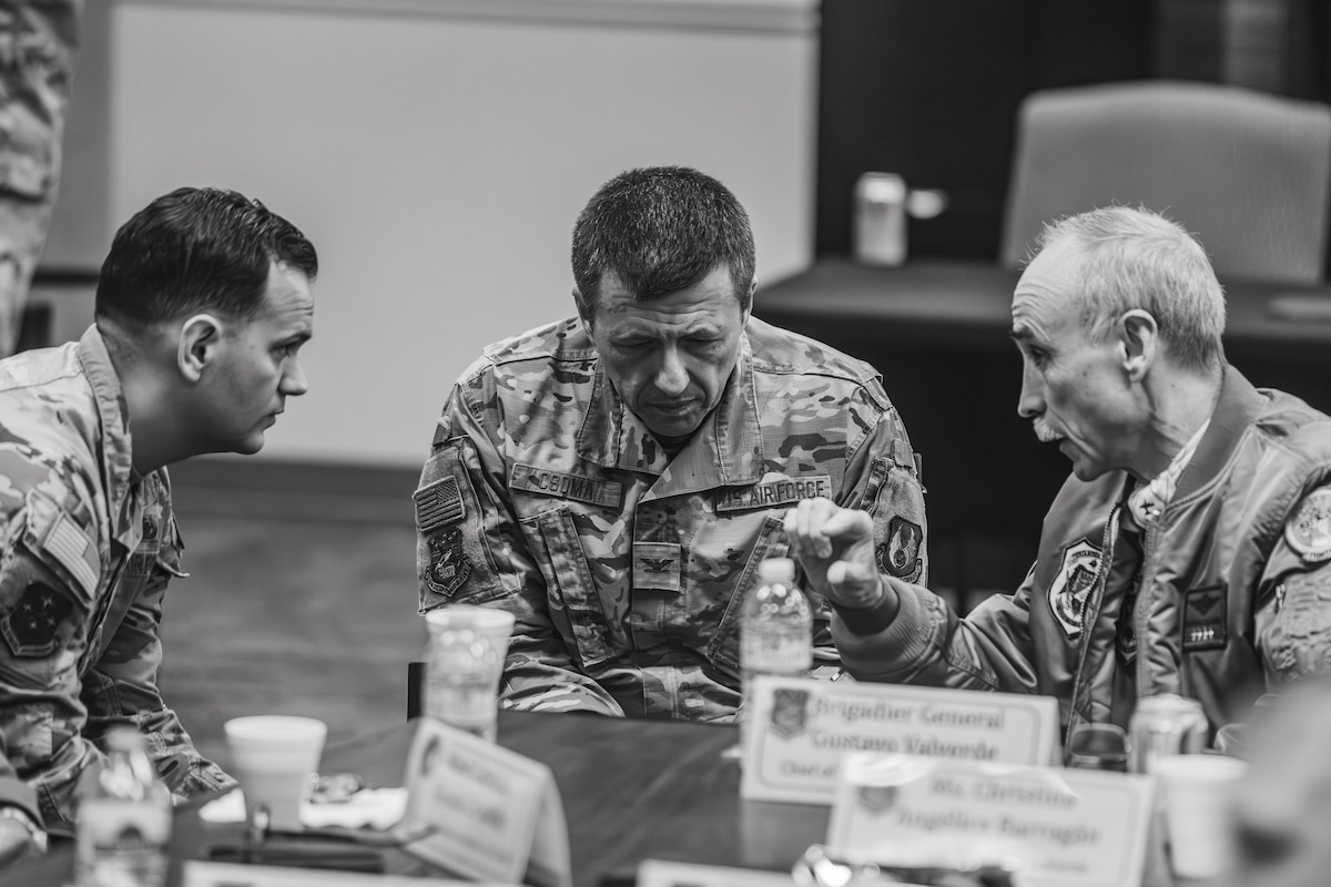 LEAP Scholar Capt. Rafael Mata (left) interprets during a meeting between Col. Ernest Csoma, Director F-16 Program (center), and Brig. Gen. Valverde, Chief of Staff of the Argentinian Air Force