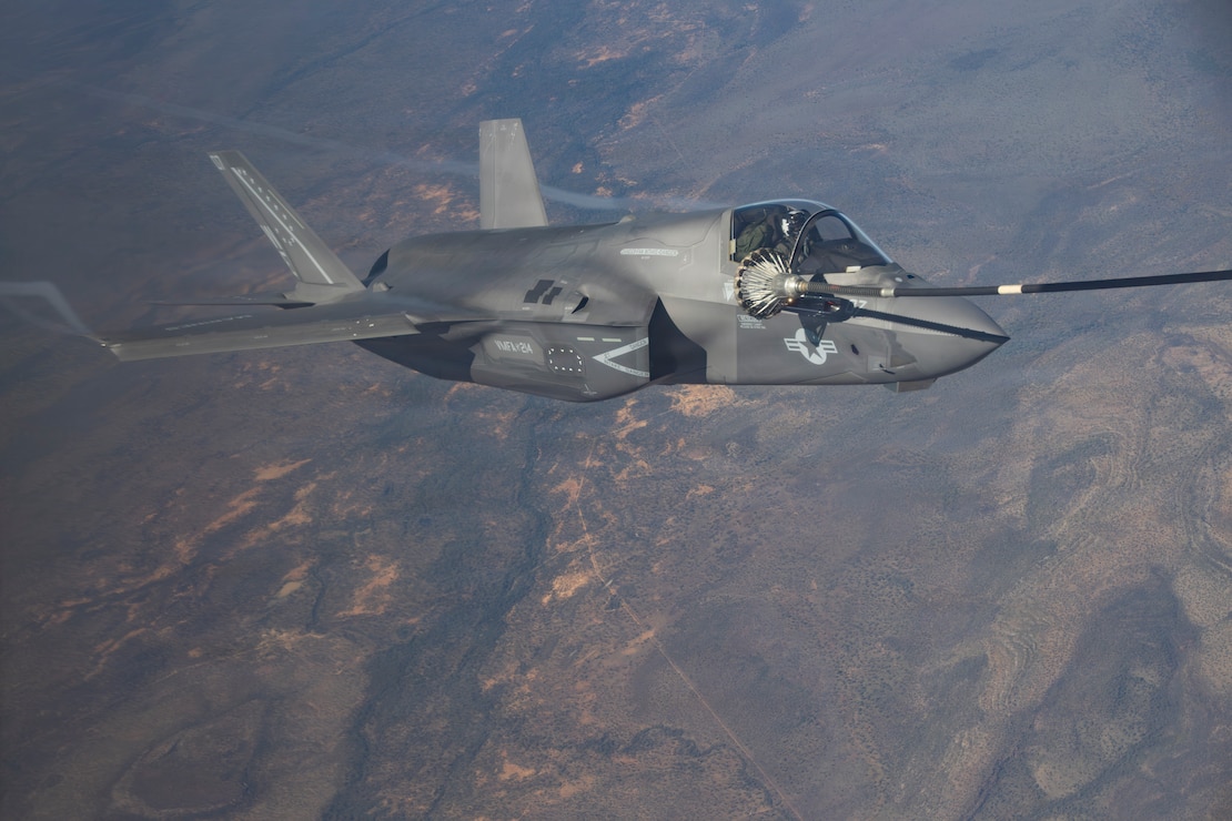 A U.S. Marine Corps F-35B Lightning II assigned to Marine Fighter Attack Squadron (VMFA) 214, Marine Aircraft Group 13, 3rd Marine Aircraft Wing, receives fuel from a KC-130J Hercules assigned to Marine Aerial Refueler Transport Squadron (VMGR) 352, MAG-11, 3rd MAW as part of exercise Slingshot above Darwin, Australia, June 24, 2026.
