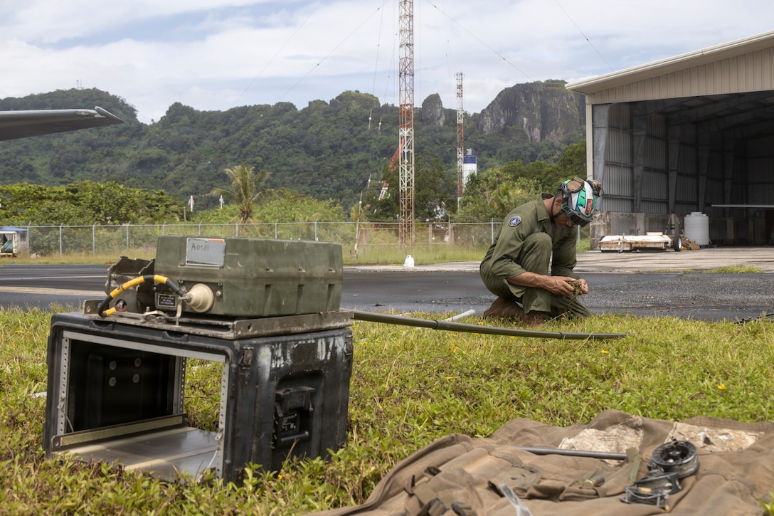 U.S. Marine Corps Staff Sgt. Marcus Santana, an F-35B fixed-wing aircraft airframe mechanic with Marine Fighter Attack Squadron (VMFA) 214, Marine Aircraft Group 13, 3rd Marine Aircraft Wing, sets up a L3Harris AN/PRC-160(V) radio as part of exercise Slingshot in Pohnpei, Micronesia, June 26, 2026.