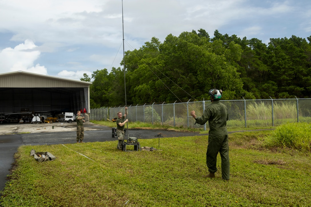U.S. Marines with Marine Fighter Attack Squadron (VMFA) 214, Marine Aircraft Group 13, 3rd Marine Aircraft Wing, set up a L3Harris AN/PRC-160(V) radio and a AN/TRC-209 radio frequency amplifier as part of exercise Slingshot in Pohnpei, Micronesia, June 26, 2026.