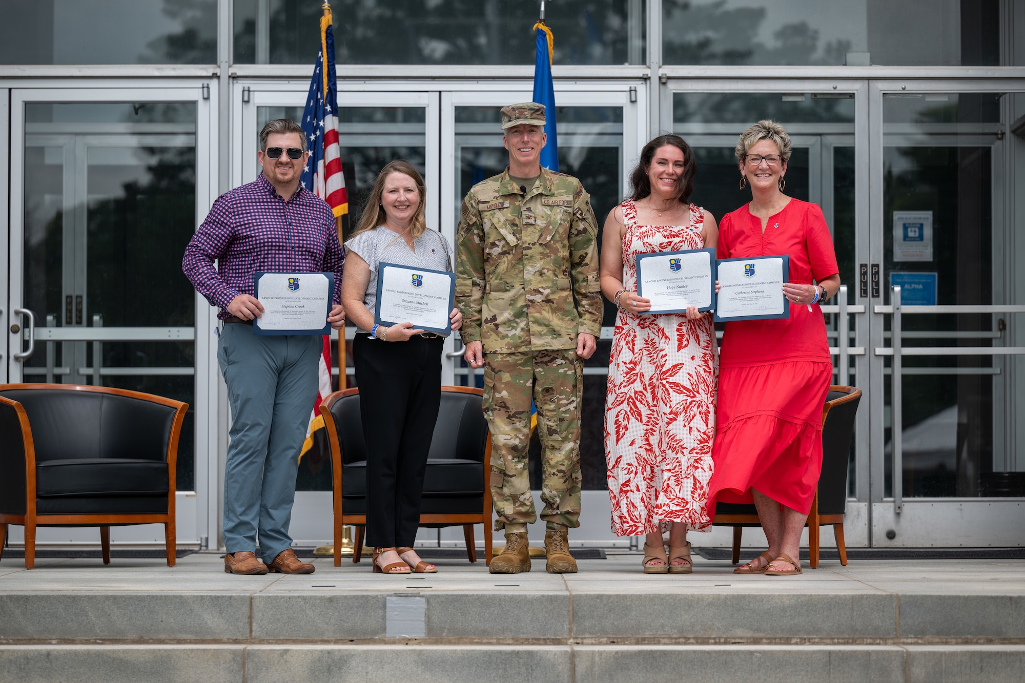 Members of the first class of Arnold Air Force Base Honorary Commanders are recognized during induction ceremony for the second class of Arnold AFB Honorary Commanders June 27, 2026, at Arnold AFB, Tenn. Pictured from left are Stephen Crook, Suzanne Mitchell, outgoing Arnold Engineering Development Complex Commander Col. Grant Mizell, Hope Nunley and Catherine Stephens. Arnold AFB is the headquarters of AEDC. (U.S. Air Force photo by Keith Thornburgh)