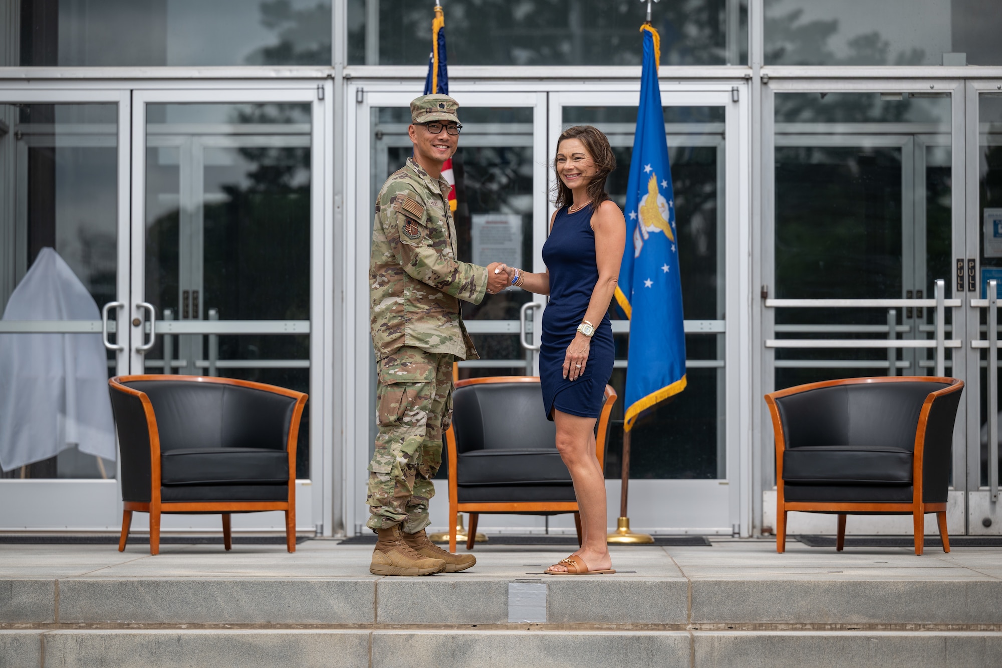 Anne Hosea-Majors, Industrial Board of Coffee County executive director, shakes hands with Arnold Engineering Development Complex Test Support Division Chief Lt. Col. Evan Valdez during the Arnold Air Force Base Honorary Commanders induction ceremony June 27, 2026, at Arnold AFB, Tenn., headquarters of AEDC. Hosea-Majors was selected as the Honorary Commander representing the Test Support Division. The Honorary Commanders were inducted during the AEDC 75th anniversary open house celebration at Arnold AFB. (U.S. Air Force photo by Keith Thornburgh)