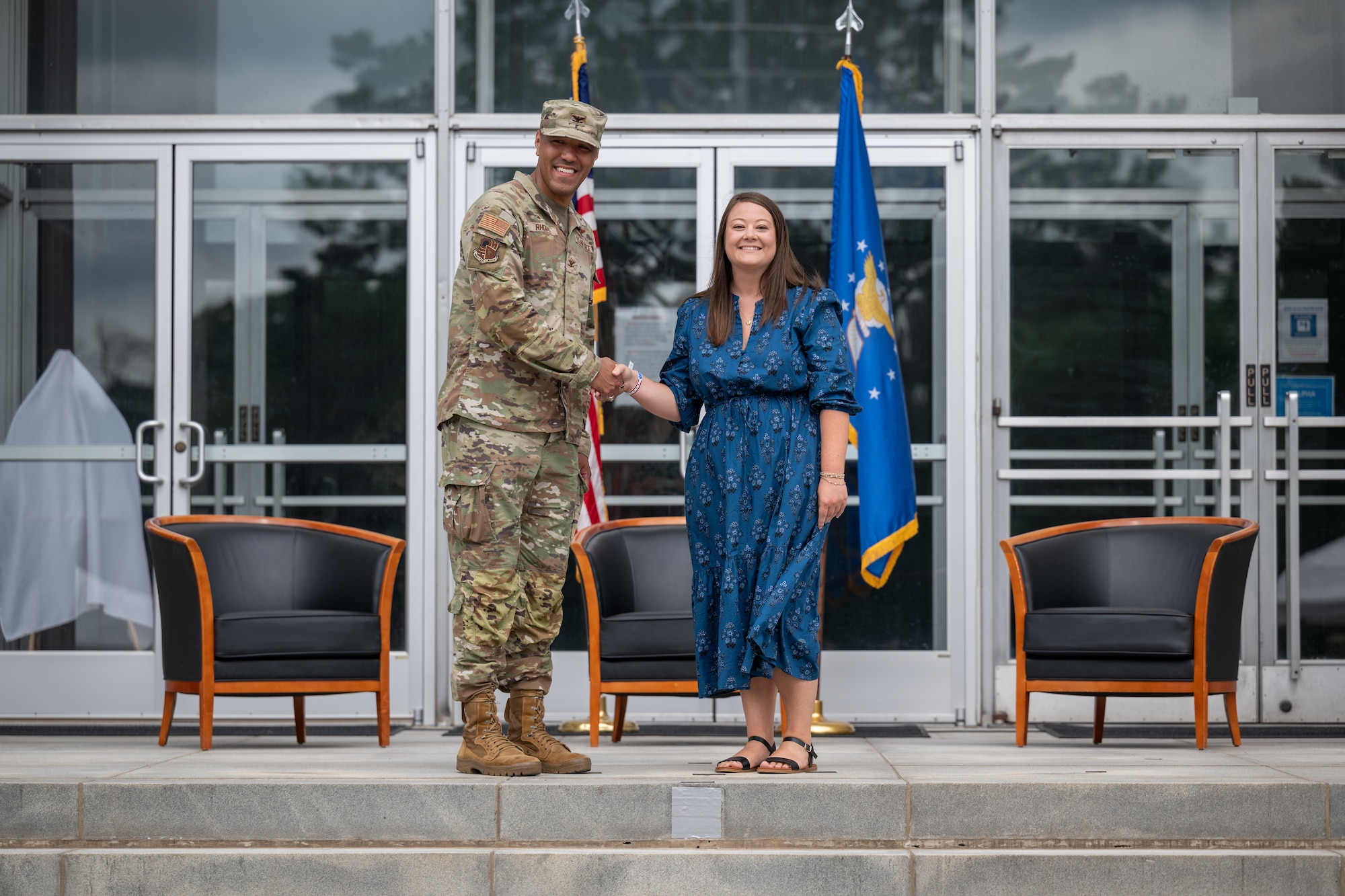 Cassie Fulmer, Franklin County Chamber of Commerce executive director, shakes hands with 804th Test Group Commander Col. Jack Rhodes during the Arnold Air Force Base Honorary Commanders induction ceremony June 27, 2026, at Arnold AFB, Tenn., headquarters of Arnold Engineering Development Complex. Fulmer was selected as the Honorary Commander representing the 804 TG. The Honorary Commanders were inducted during the AEDC 75th anniversary open house celebration at Arnold AFB. (U.S. Air Force photo by Keith Thornburgh)