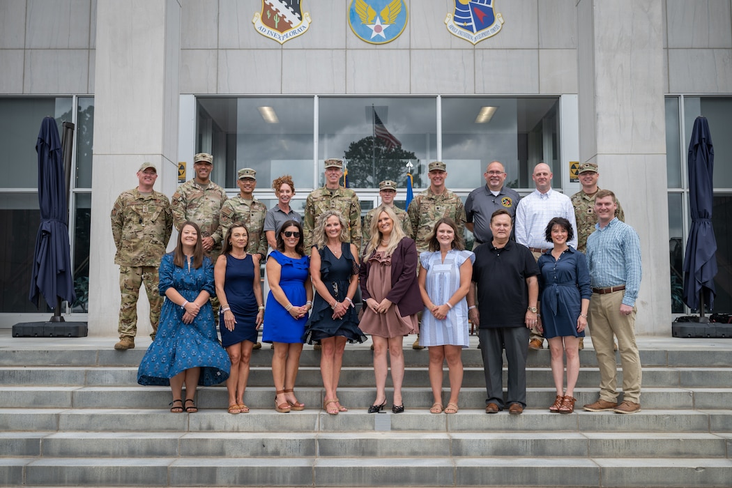 The second class of Arnold Air Force Base Honorary Commanders pose for a photo June 27, 2026, at Arnold AFB, Tenn., with Arnold Engineering Development Complex leaders who serve in the units and offices represented by the Honorary Commanders. The Honorary Commanders, pictured front row from left, are Cassie Fulmer, Anne Hosea-Majors, Katy Riddle, April Norris, Ashley Gibbs, Rachel Shields, Greg Gressel, Kelly North and Austin Sisco. AEDC leaders pictured, top row from left, are AEDC Senior Enlisted Leader Chief Master Sgt. Evan McCoy, 804th Test Group Commander Col. Jack Rhodes, Test Support Division Chief Lt. Col. Evan Valdez, Acquisition Program Manager Kathleen Bajar, outgoing AEDC Commander Col. Grant Mizell, 718th Test Squadron Commander Lt. Col. Rachel Chrash, 717th Test Squadron Commander Lt. Col. Jonathan Tellefsen, 715th Test Squadron Director Jeffrey Staines, Test Support Squadron Director Dustin Boss and 716th Test Squadron Commander Lt. Col. Jason Thomas. Arnold AFB is the headquarters of AEDC. (U.S. Air Force photo by Keith Thornburgh)
