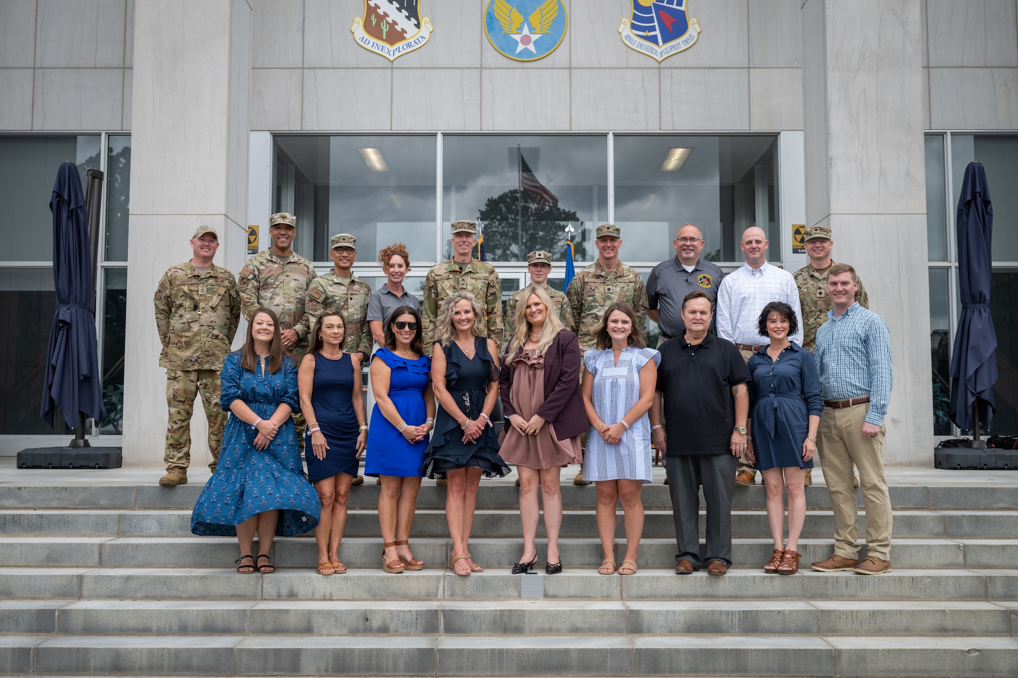 The second class of Arnold Air Force Base Honorary Commanders pose for a photo June 27, 2026, at Arnold AFB, Tenn., with Arnold Engineering Development Complex leaders who serve in the units and offices represented by the Honorary Commanders. The Honorary Commanders, pictured front row from left, are Cassie Fulmer, Anne Hosea-Majors, Katy Riddle, April Norris, Ashley Gibbs, Rachel Shields, Greg Gressel, Kelly North and Austin Sisco. AEDC leaders pictured, top row from left, are AEDC Senior Enlisted Leader Chief Master Sgt. Evan McCoy, 804th Test Group Commander Col. Jack Rhodes, Test Support Division Chief Lt. Col. Evan Valdez, Acquisition Program Manager Kathleen Bajar, outgoing AEDC Commander Col. Grant Mizell, 718th Test Squadron Commander Lt. Col. Rachel Chrash, 717th Test Squadron Commander Lt. Col. Jonathan Tellefsen, 715th Test Squadron Director Jeffrey Staines, Test Support Squadron Director Dustin Boss and 716th Test Squadron Commander Lt. Col. Jason Thomas. Arnold AFB is the headquarters of AEDC. (U.S. Air Force photo by Keith Thornburgh)
