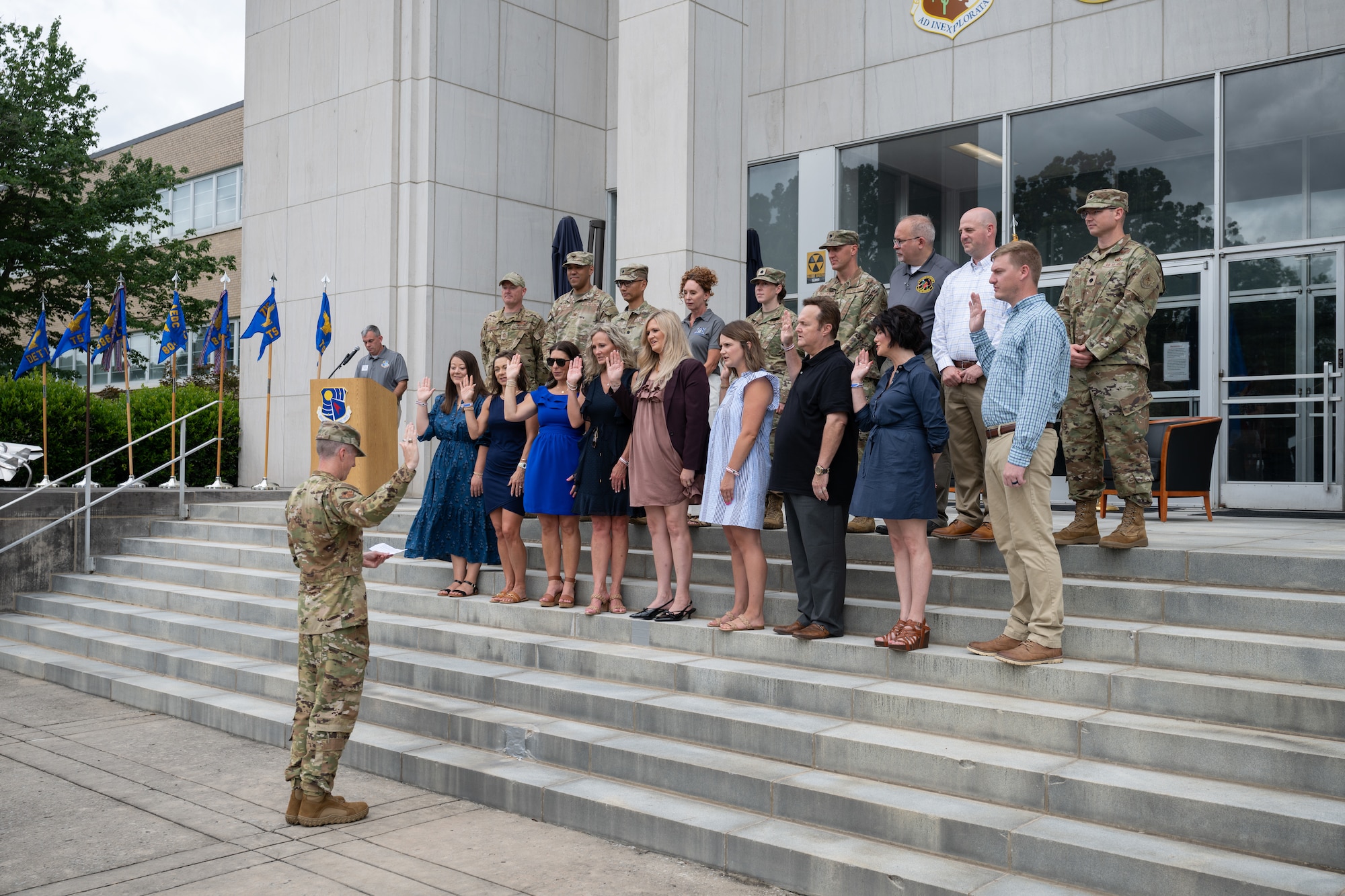 Outgoing Arnold Engineering Development Complex Commander Col. Grant Mizell, left, administers the Oath of Induction to the newest Arnold Air Force Base Honorary Commanders during a June 27, 2026, ceremony at Arnold AFB, Tenn., headquarters of AEDC. Nine local business and community leaders were selected to serve as the second class of Arnold AFB Honorary Commanders. The selectees were inducted during the AEDC 75th anniversary open house celebration at Arnold AFB. (U.S. Air Force photo by Keith Thornburgh)