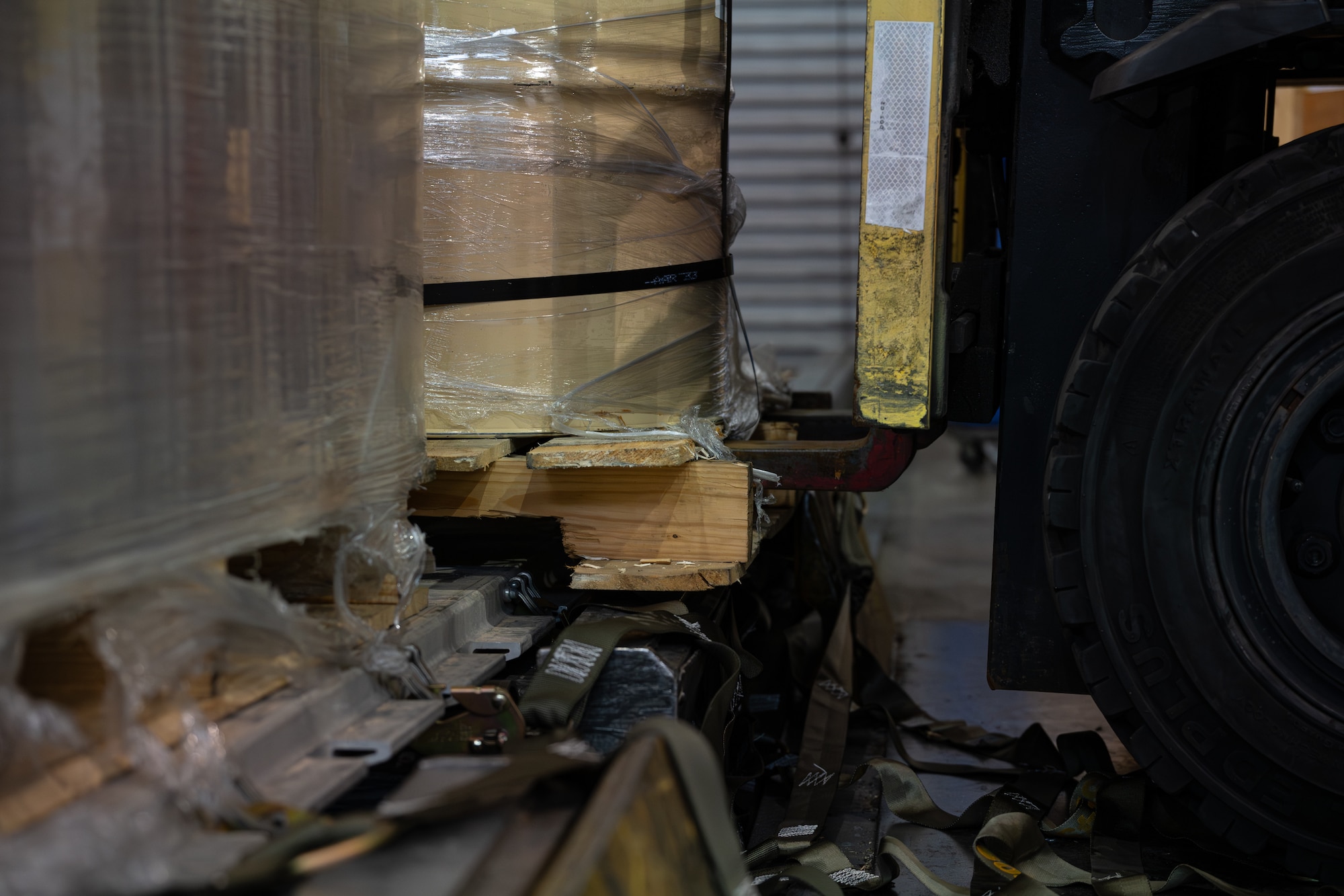 Cargo pallets await to be secured with straps inside the cargo bay on Dover Air Force Base, Delaware, June 24, 2026.