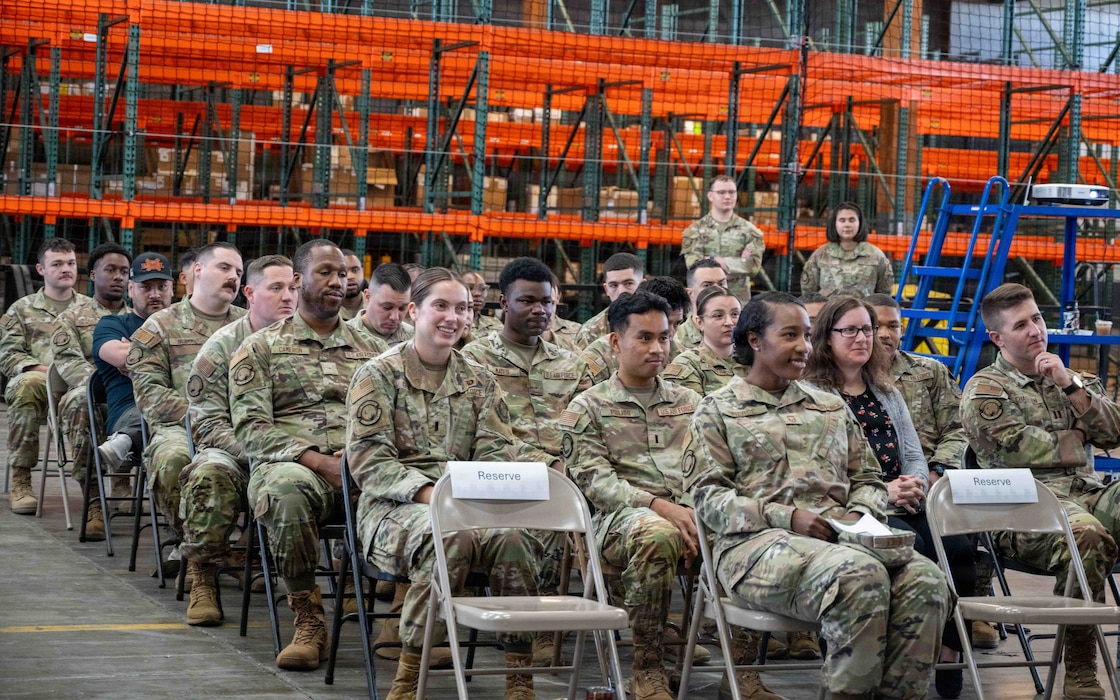 Airmen sit during an assembly.