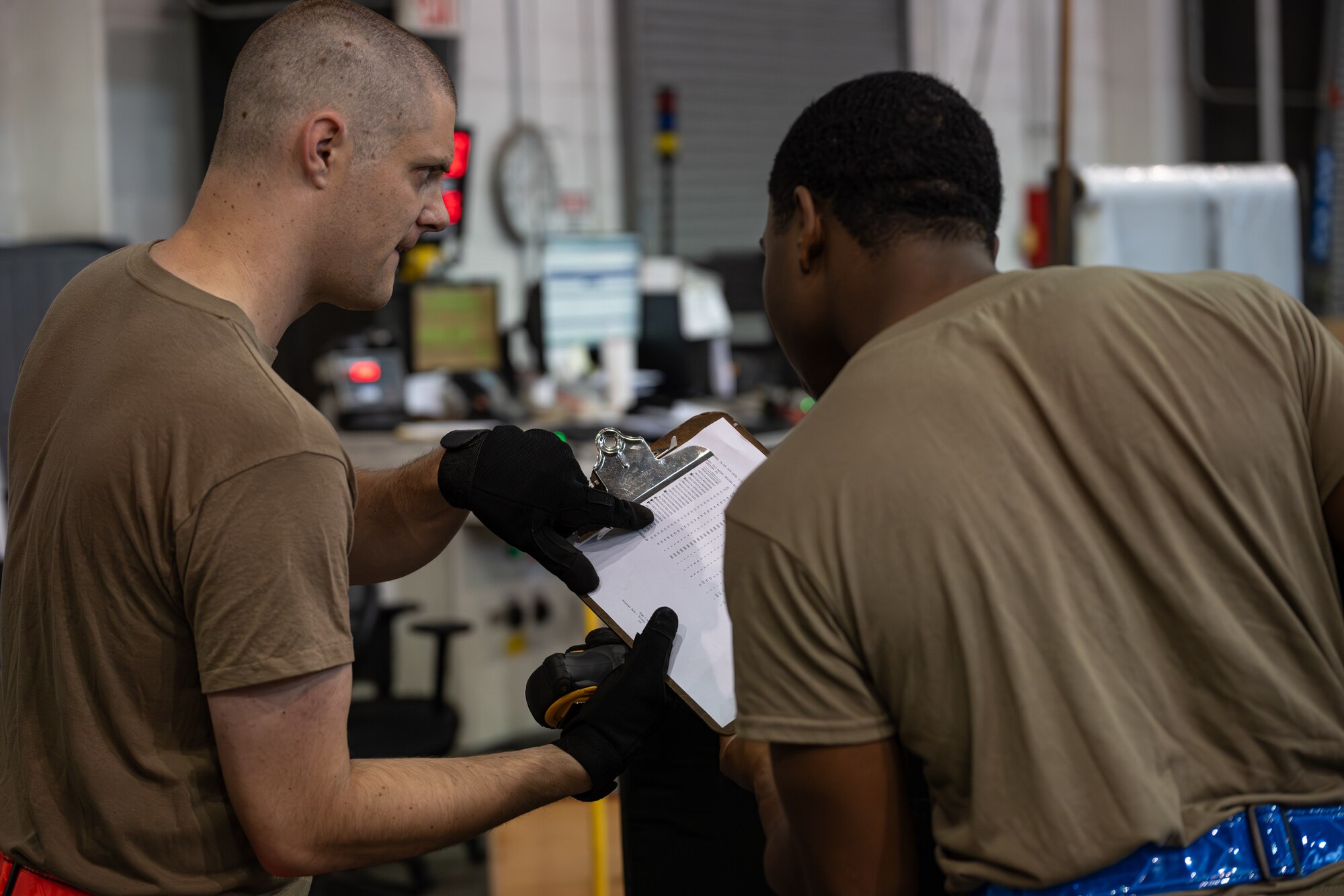 U.S. Air Force Staff Sgt. Zach Scherry, 436th Aerial Port Squadron cargo supervisor, and Airman Clark Bote, 436th APS processor, go through the steps of packaging a cargo pallet on Dover Air Force Base, Delaware, June 24, 2026.