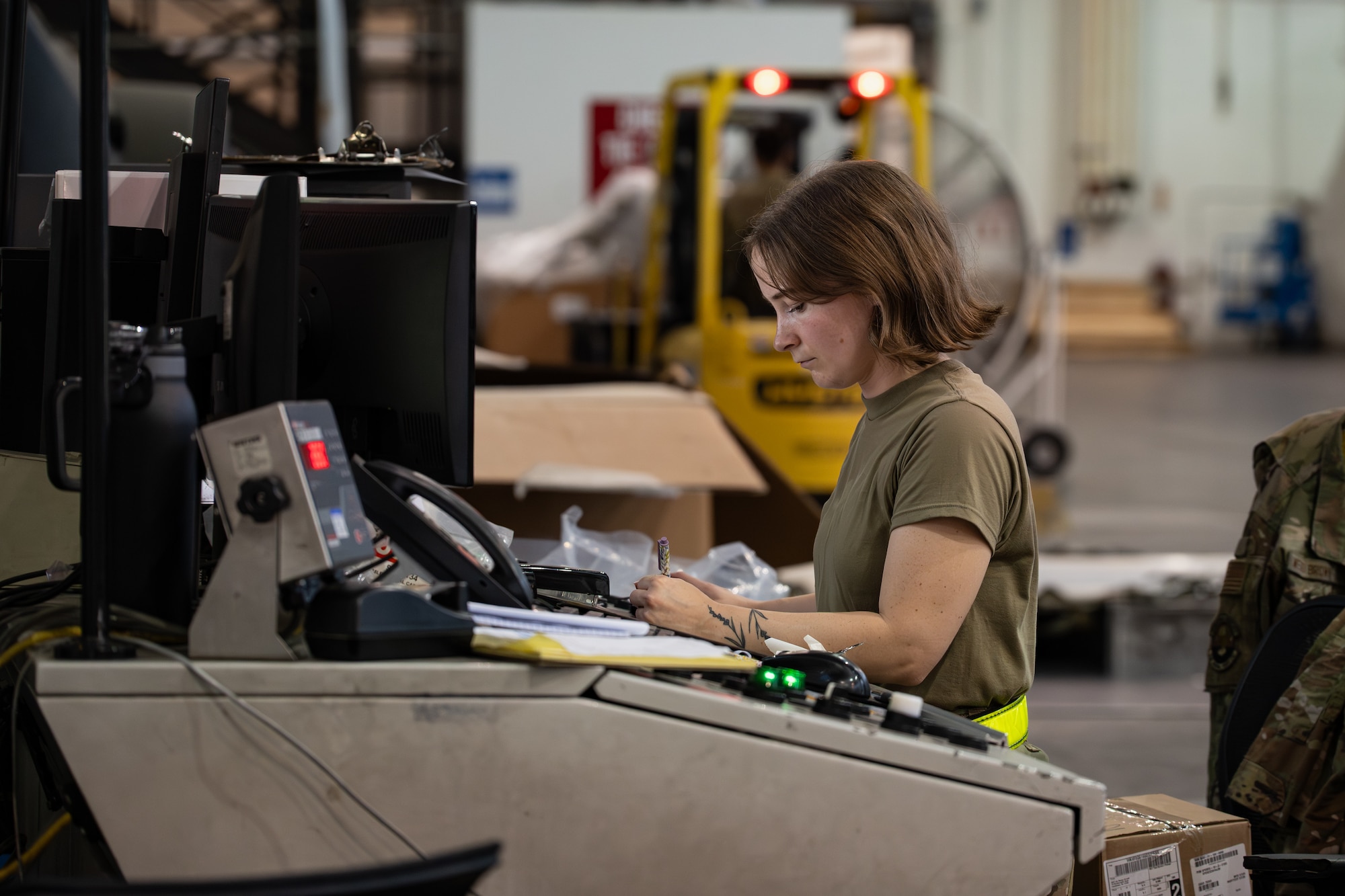 U.S. Air Force Senior Airman Marian Mullen, 436th Aerial Port Squadron processor, documents a cargo load’s contents on Dover Air Force Base, Delaware, June 24, 2026.