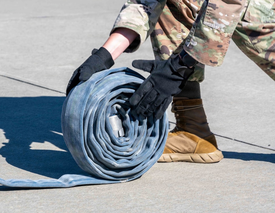 Hose is being rolled during a relay race.