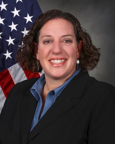 Photo of Caucasian woman in front of the American flag