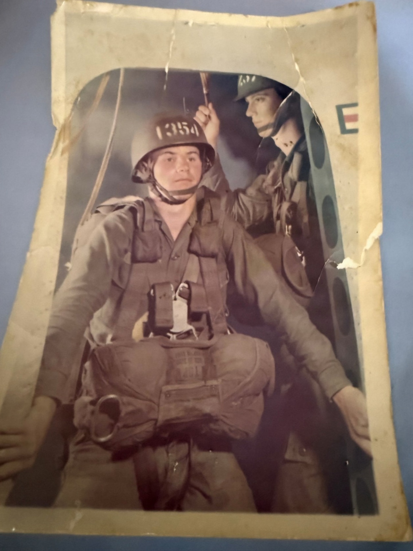 Photograph of Specialist Fourth Class Raymond Williams in full airborne military gear, preparing for training exercise jump 1354, circa 1967–1968, before deploying to Vietnam.