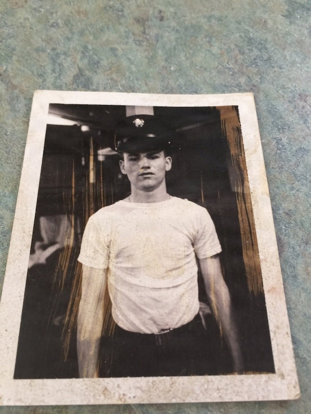 A black-and-white photograph of Specialist Fourth Class Raymond Williams in his military uniform at Fort Devens, Massachusetts, circa 1967. He is looking directly at the camera, pictured from the chest up before his deployment to Vietnam.