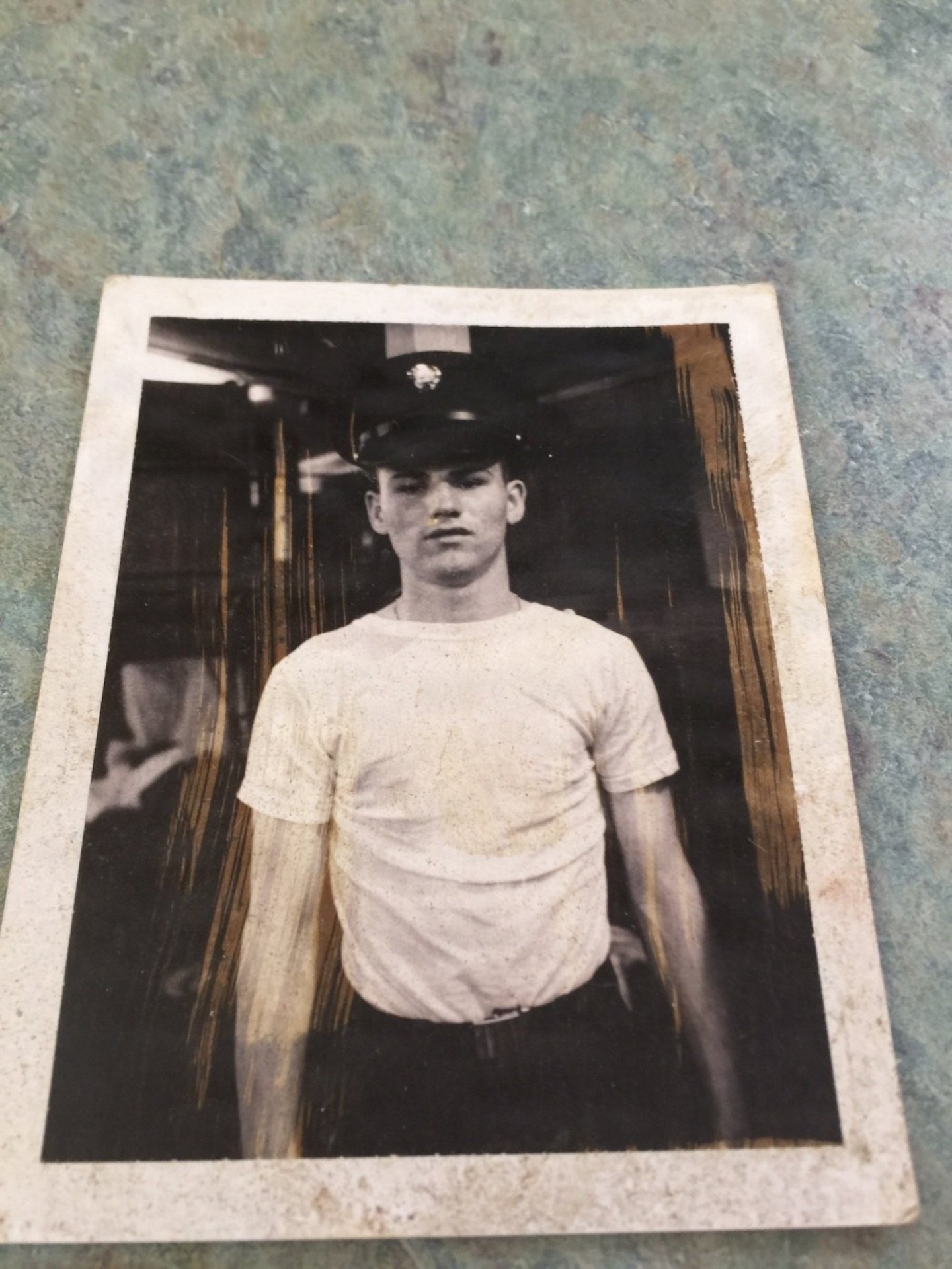 A black-and-white photograph of Specialist Fourth Class Raymond Williams in his military uniform at Fort Devens, Massachusetts, circa 1967. He is looking directly at the camera, pictured from the chest up before his deployment to Vietnam.