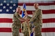 U.S. Air Force Col. Jimmy Schlabach, 91st Missile Wing commander (left), relinquishes the guidon to Col. Daniel Shimonsky, 91st Operations Group incoming commander, during a change of command ceremony at Minot Air Force Base, North Dakota, June 24, 2026.
