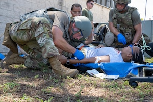 Airman inserts an IV catheter in a volunteer