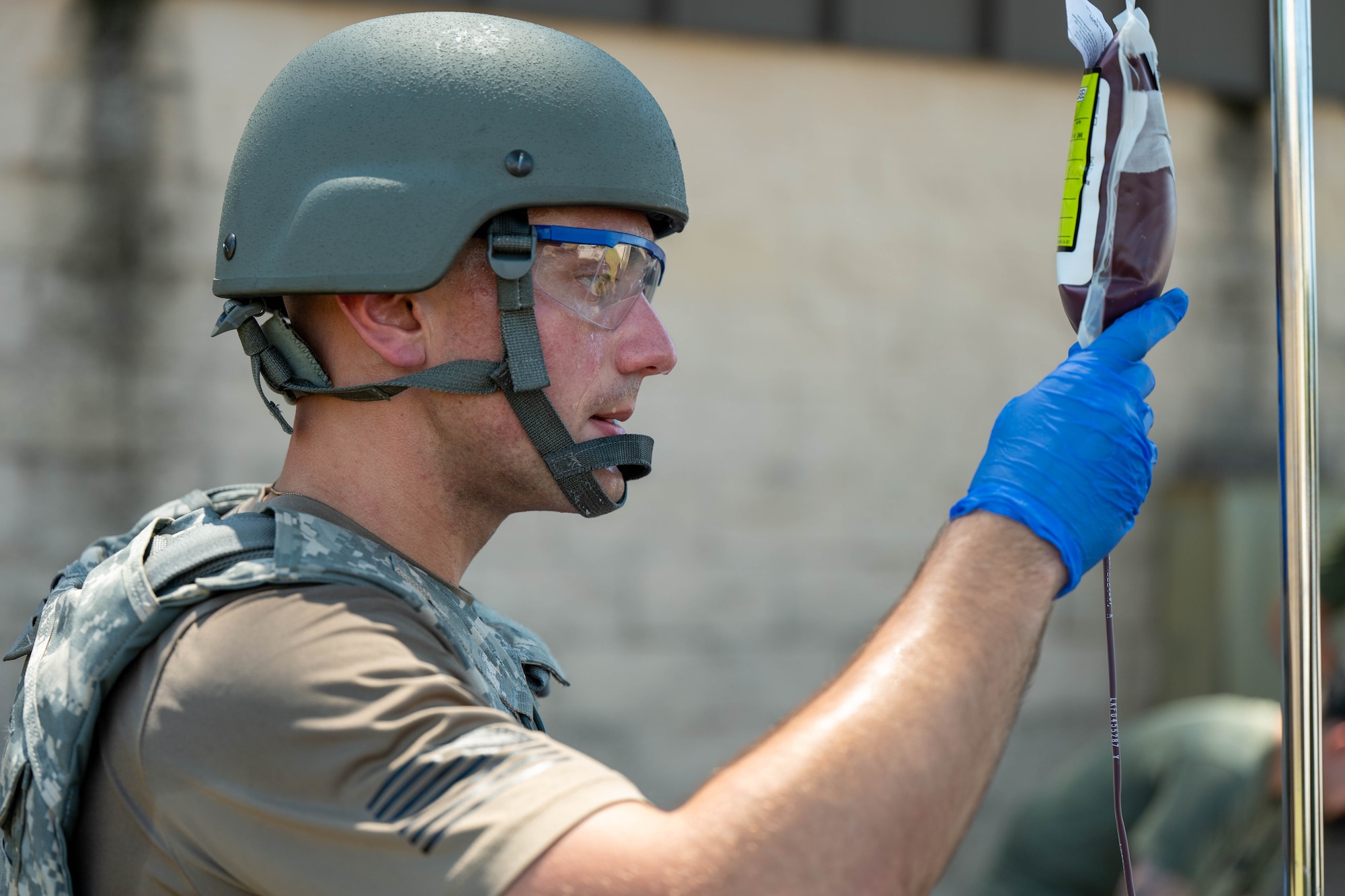 Airman inspects blood bag