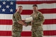 U.S. Air Force Col. Jimmy Schlabach, 91st Missile Wing commander (left), presents the Legion of Merit to Col. Michael Suden, 91st Operations Group outgoing commander, during a change of command ceremony at Minot Air Force Base, North Dakota, June 24, 2026.