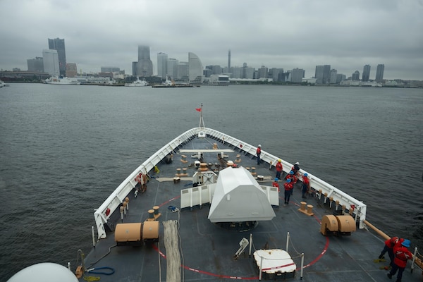 Crew members assigned to Legend-class cutter USCGC Midgett (WMSL 757) prepare the forecastle for mooring operations in Yokohama, Japan, during Pacific Atlas, June 18, 2026.