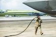 U.S. Army Reserve Sgt. Soonafai Seloti, Forward Support Company 411th Engineer Battalion, 303rd Maneuver Enhancement Brigade, 9th Mission Support Command, prepares to connect the fuel hose of a U.S. Army Heavy Expanded Mobility Tactical Truck to refuel a U.S. Air Force F-35 Lightning II, 4th Expeditionary Fighter Squadron, June 22, 2026, at Anderson Air Force Base, Guam, as part of exercise Valiant Shield 2026 (VS26). Joint exercises such as VS26 allow the USPACOM joint force the opportunity to integrate the Navy, Marine Corps, Army, Air Force, Coast Guard, and Space Force to conduct precise, lethal, and overwhelming multi-axis, multi-domain effects that demonstrate the strength and versatility of the joint force. (U.S. Army photo by Staff Sgt. Christopher Scott)