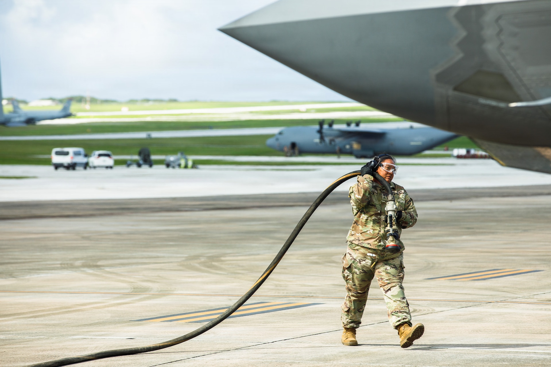 U.S. Army Reserve Sgt. Soonafai Seloti, Forward Support Company 411th Engineer Battalion, 303rd Maneuver Enhancement Brigade, 9th Mission Support Command, prepares to connect the fuel hose of a U.S. Army Heavy Expanded Mobility Tactical Truck to refuel a U.S. Air Force F-35 Lightning II, 4th Expeditionary Fighter Squadron, June 22, 2026, at Anderson Air Force Base, Guam, as part of exercise Valiant Shield 2026 (VS26).