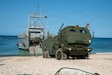 U.S. Marines with 3rd Littoral Combat Team, 3rd Marine Littoral Regiment, 3rd Marine Division, and U.S. Army Soldiers with 7th Infantry Division, Multi-Domain Command - Pacific, guide an M142 High Mobility Artillery Rocket System off a U.S. Army Landing Craft Utility during a ship-to-shore movement for Exercise Balikatan 2026 at Calayan, Cagayan, Philippines, April 28, 2026.