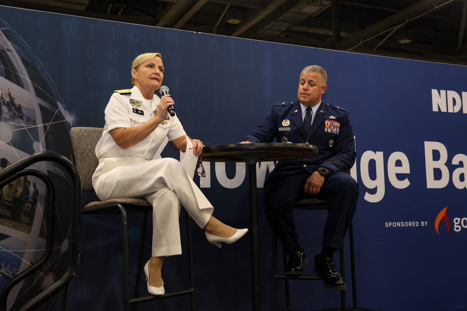 Defense Logistics Agency Weapons Support (Columbus) Commander Navy Rear Adm. Julie Treanor and DLA Weapons Support (Richmond) Commander Air Force Brig. Gen. Patrick Launey speak to industry June 2 at the DLA Supply Chain Alliance Symposium and Exhibition in Columbus, Ohio. The two leaders participated in a “Knowledge Bar” presentation where they updated industry partners on the progress of the integration of the DLA Weapons Support. (Photo by Andrew Young/DLA)