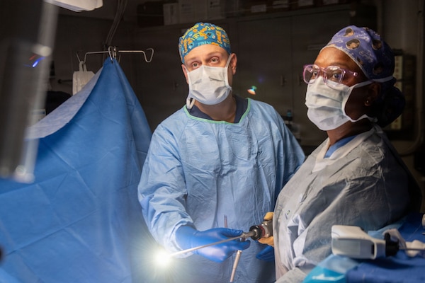U.S. Navy Hospital Corpsman 3rd Class Nicholas Muller, left, assists Lt. Cmdr. Carina Felix, Ship’s Surgeon, while performing surgery aboard Nimitz-class aircraft carrier USS Dwight D. Eisenhower (CVN 69), June 22, 2026. Eisenhower is underway in the Atlantic Ocean conducting carrier qualifications, supporting East Coast Fleet Replacement Squadrons. (U.S. Navy photo by Mass Communication Specialist 3rd Class Evan Antonisse)