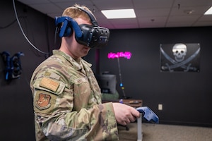 U.S. Air Force Senior Airman Trey Hall, 621st Contingency Response Group training manager, uses virtual reality equipment for training at Joint Base McGuire-Dix-Lakehurst, N.J., June 23, 2026.