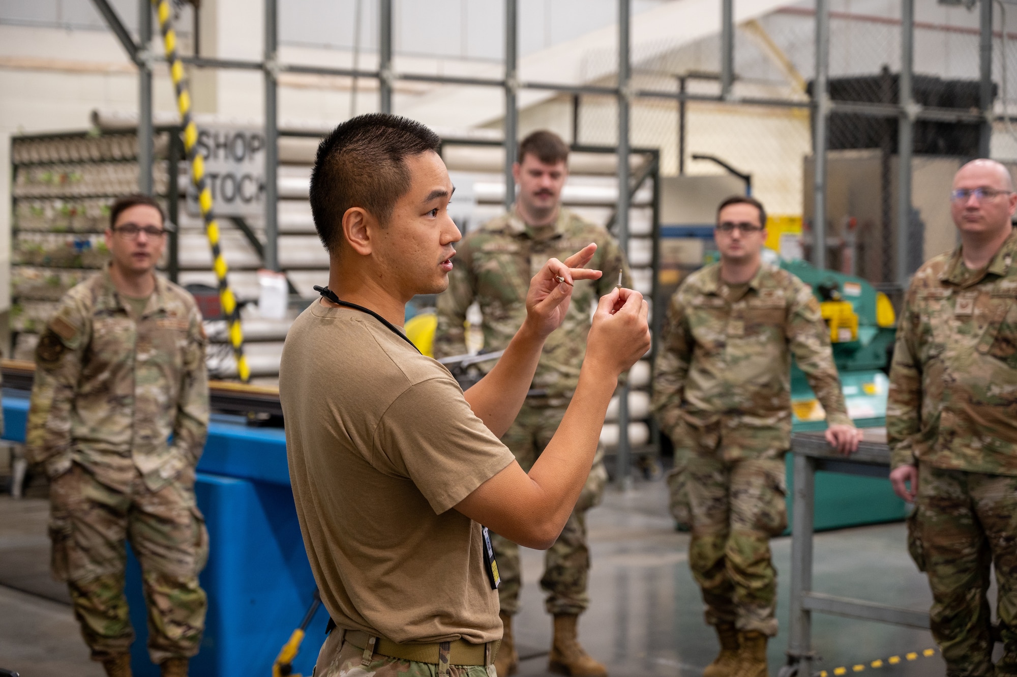 U.S. Air Force Tech. Sgt. Will Chen, 305th Air Mobility Wing aircraft structural maintenance craftsman and Aircraft Battle Damage Evaluator course instructor, displays components needed to apply a rivet at Joint Base McGuire-Dix-Lakehurst, N.J., June 24, 2026.