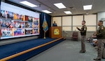 Army Col. Frankie Cochiaosue, U.S. Military Entrance Processing Command commander, and Army Command Sgt. Maj. Gary Krese, USMEPCOM senior enlisted advisor, address applicants prior to conducting a virtual Oath of Enlistment across 12 Military Entrance Processing Stations on July 1, 2026. The event is part of USMEPCOM’s 50th birthday celebration, recognizing five decades of excellence in supporting the nation’s military accession mission.