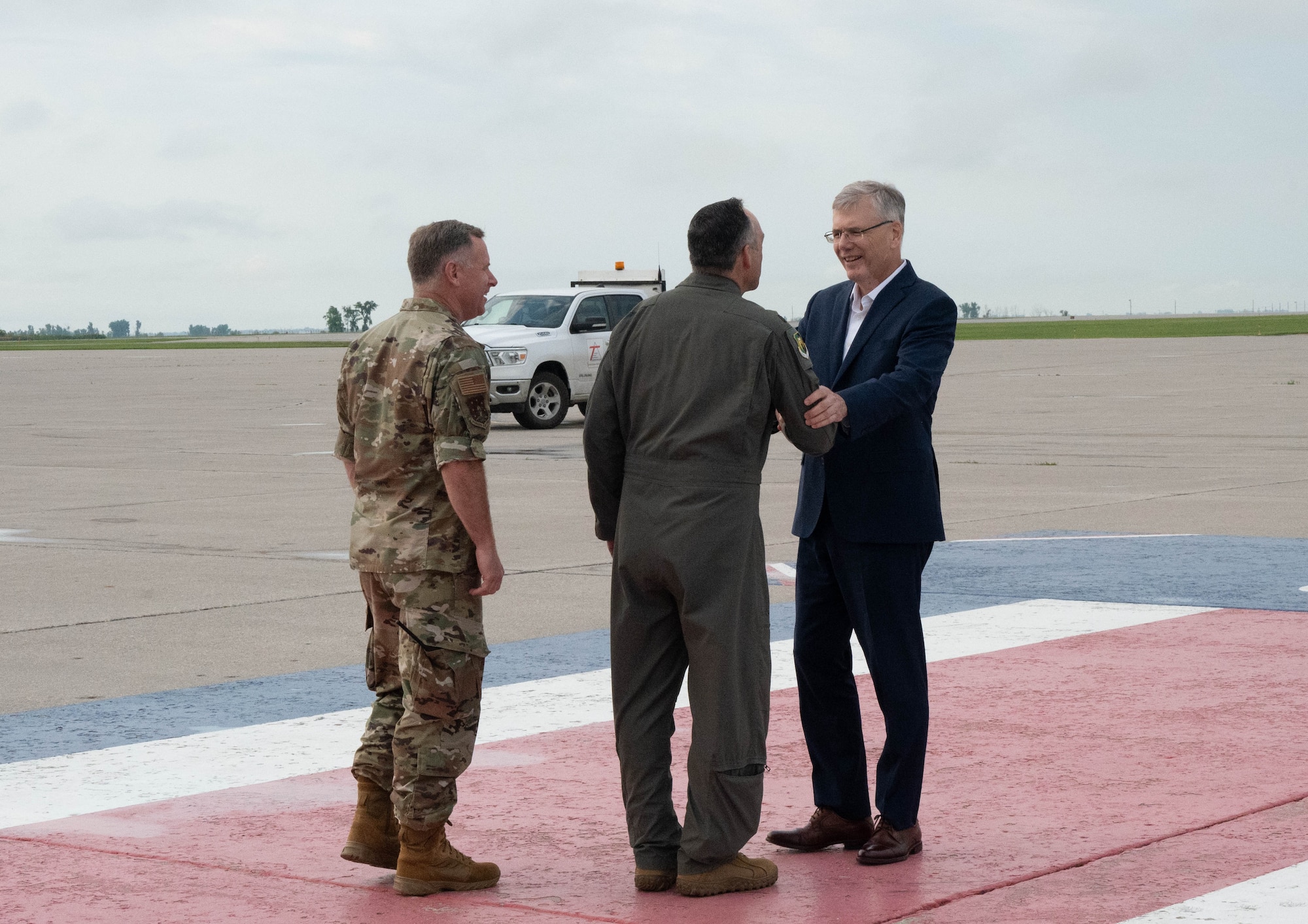 Secretary of the Air Force Troy Meink is greeted by U.S. Air Force Col. Jesse Lamarand, 5th Bomb Wing commander, and U.S. Air Force Col. James Schlabach, 91st Missile Wing commander, upon arrival at Minot Air Force Base, North Dakota, June 29, 2026. The visit reinforced Minot AFB’s commitment to strengthening readiness, enhancing warfighting capabilities, and maintaining credible deterrence in support of national defense objectives. (U.S. Air Force photo by Senior Airman Wesley Davies)