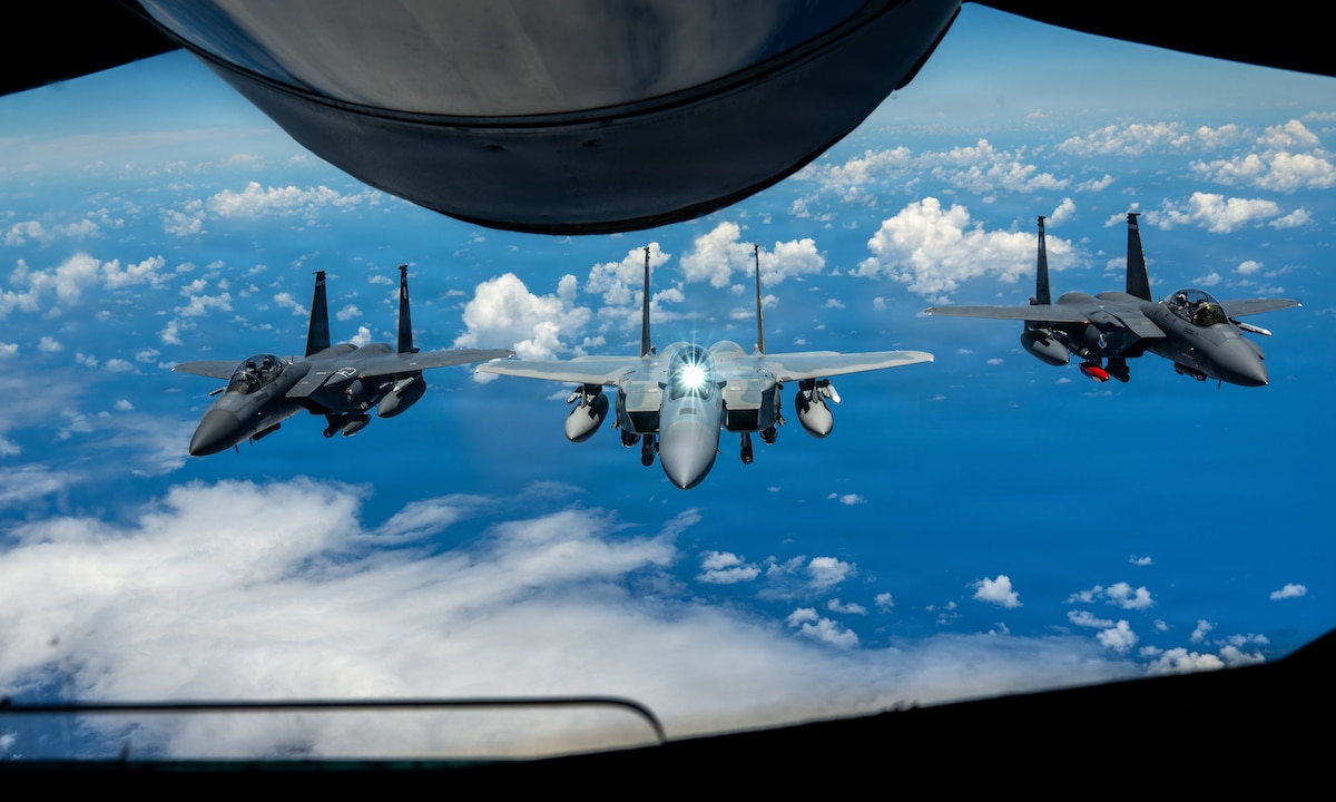 A U.S. Air Force F-15EX Eagle II and F-15E Strike Eagles assigned to the 85th Test and Evaluation Squadron, Eglin Air Force Base, Florida, fly in formation after receiving fuel from a KC-135 Stratotanker assigned to the 909th Air Refueling Squadron over the Pacific Ocean, June 29, 2026.