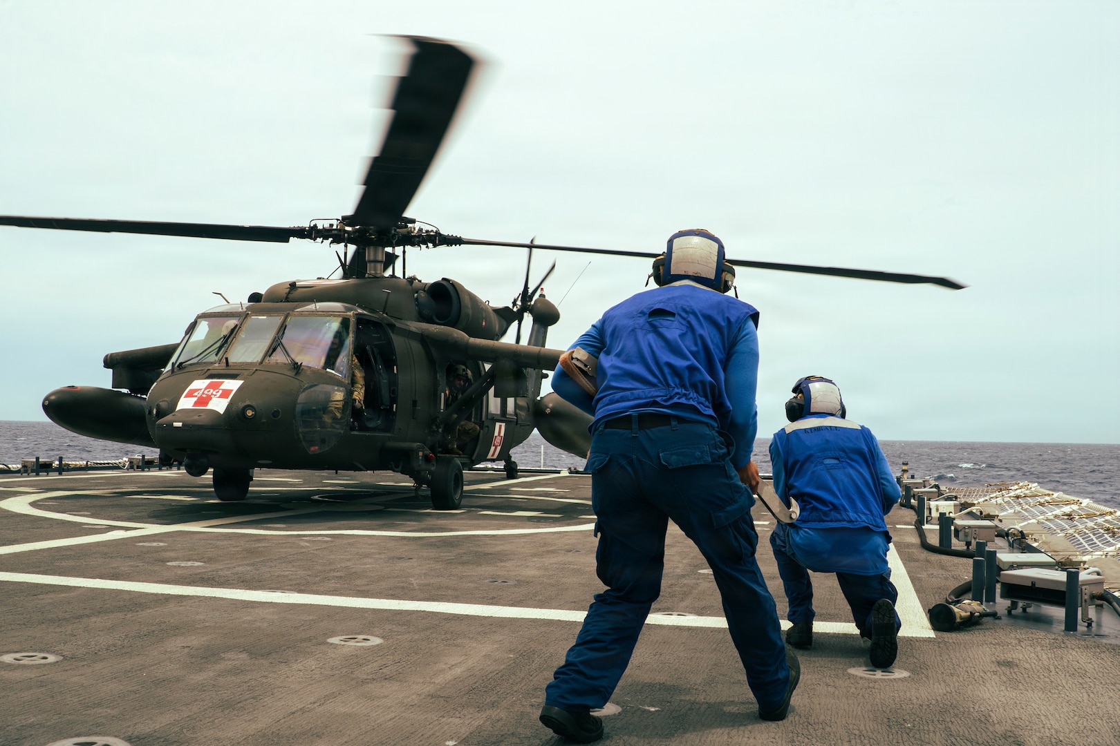 The Legend-class national security cutter USCGC Kimball (WMSL 756) crew members conduct helicopter training with a U.S. Army MH-60 aircrew from the 1-228th Aviation Regiment while patrolling off the coast of Honduras June 2, 2026. Opportunities to conduct joint training enhances interoperability between the services and qualified eight pilots ahead of hurricane season. (U.S. Coast Guard photo by Petty Officer 2nd Class Emigdio Virgen)