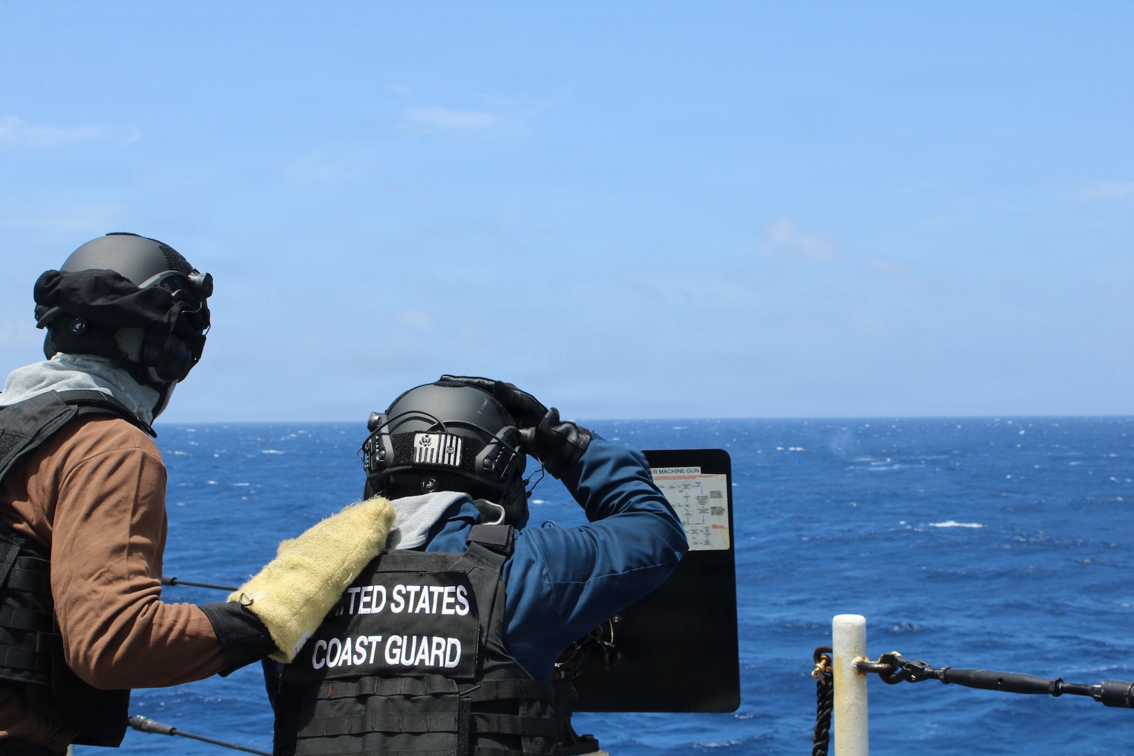 Crewmembers aboard the Legend-class national security cutter USCGC Kimball (WMSL 756) conduct weapons exercises with .50‑caliber and M240 crew‑served weapons, simulating responses to potential threats and the interdiction of illegal drug or migrant vessels while patrolling the Pacific Ocean, June 15, 2026. These drills enhance crew readiness and proficiency in supporting the Coast Guard’s maritime security mission. (U.S. Coast Guard photo by Ensign James Griswold).